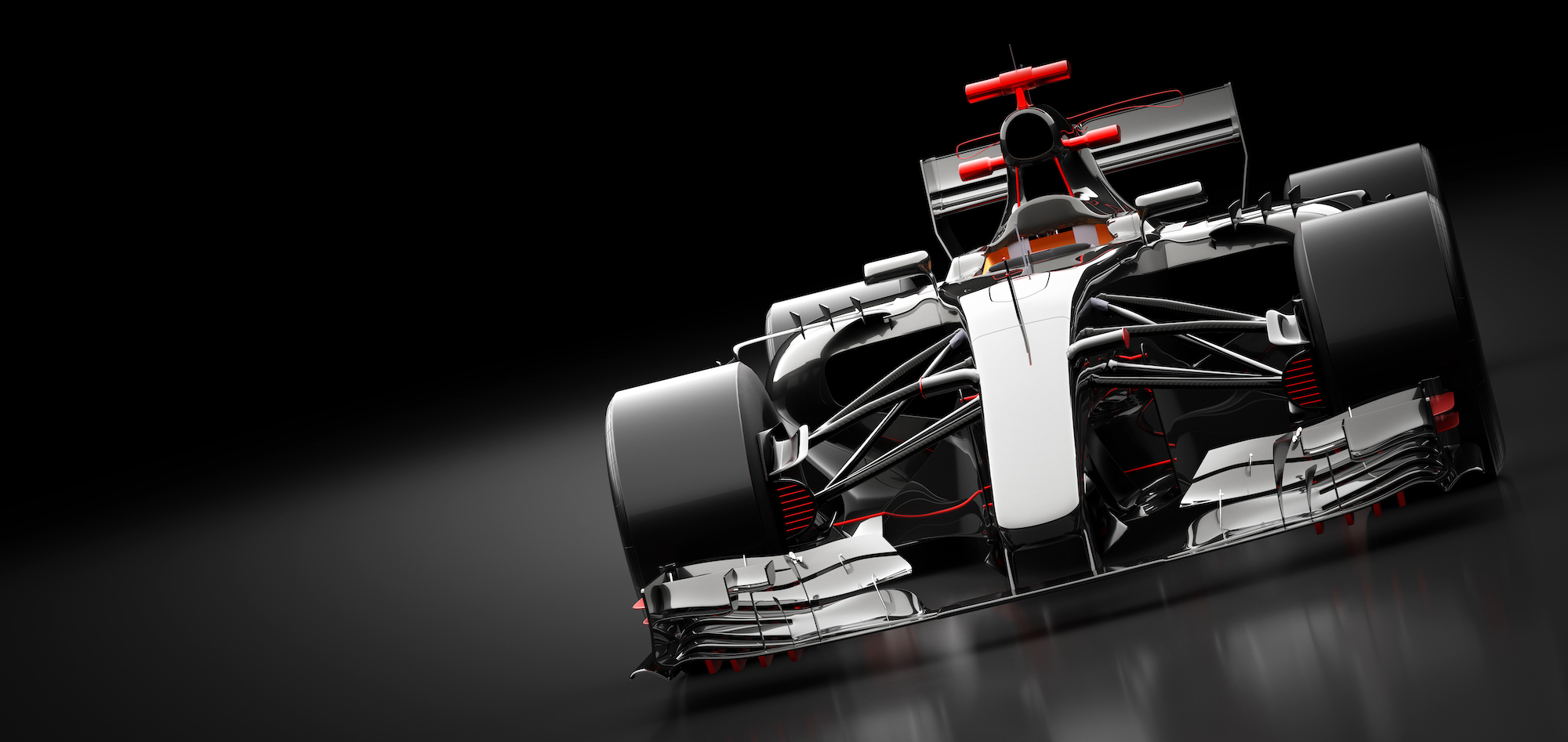 Formula One race car on a dark reflective background