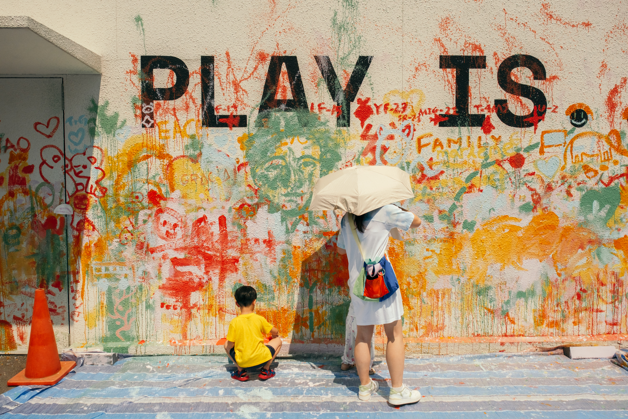Visitors contributing to the community mural at PlayCourt in Singapore Science Park