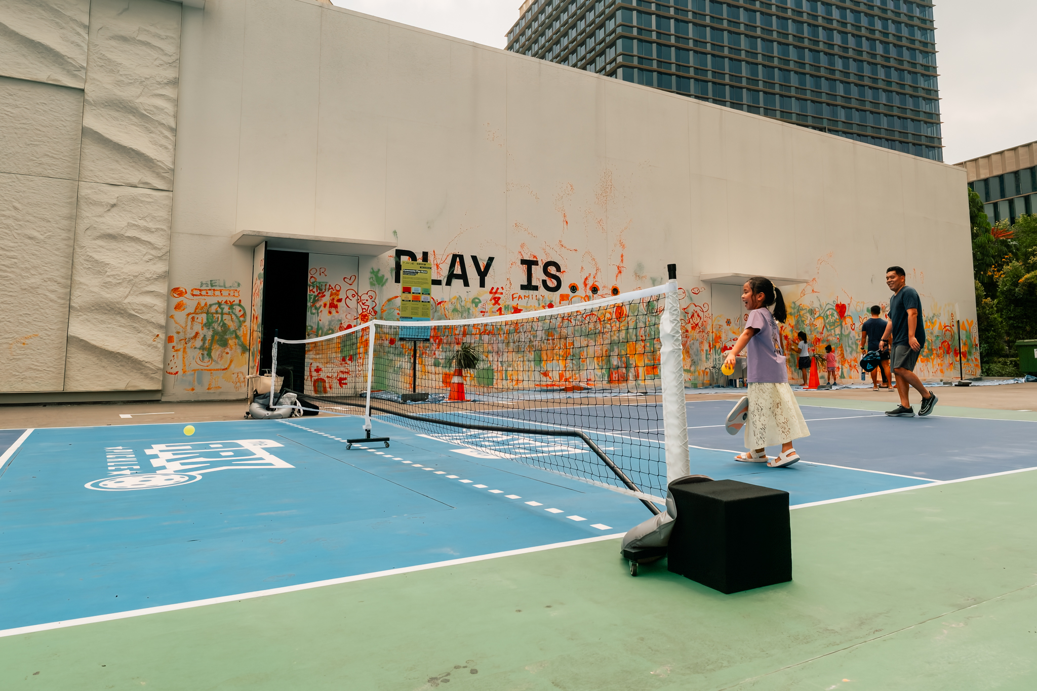 A child and adult using PlayCourt at Singapore Science Park